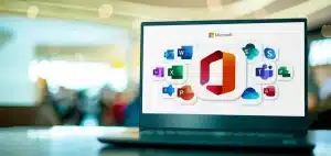 Image of a laptop with Microsoft 365 business applications on its screen.