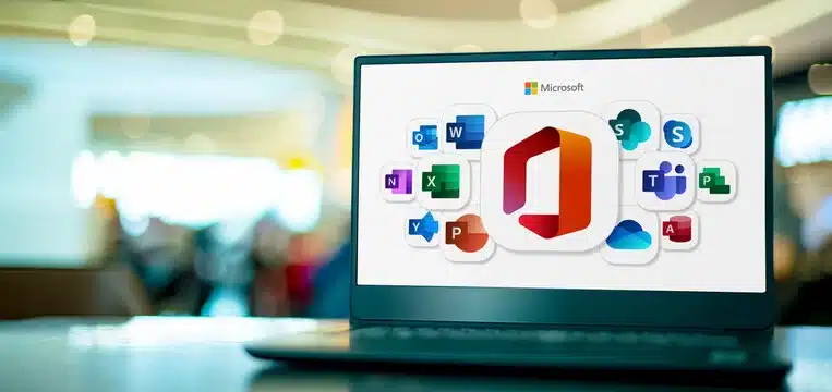 Image of a laptop with Microsoft 365 business applications on its screen.